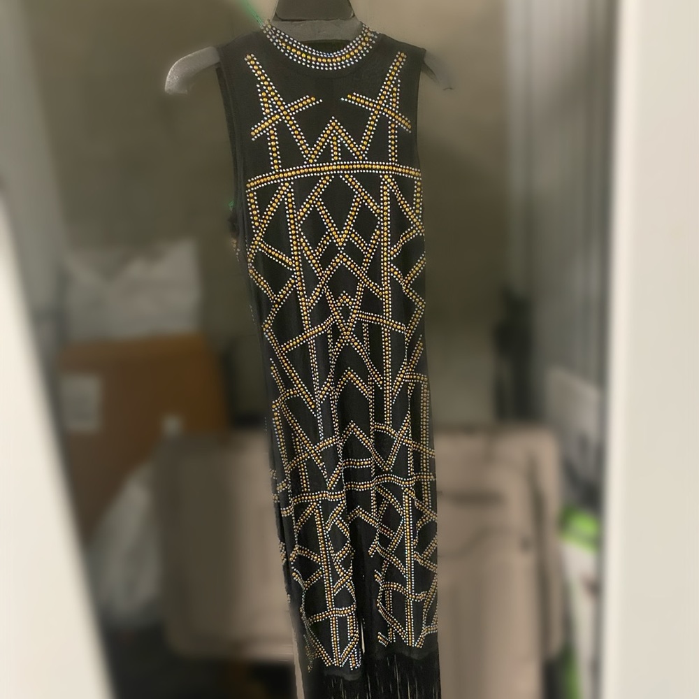 Black and gold studded jumpsuit with fringe bottom